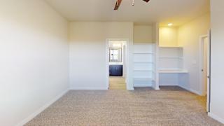 A room with a window, a bench, and a shelf. at Bridge at Speyside Apartments, Austin, Texas
