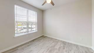 Empty room with ceiling fan and window blinds at Bridge at Windsor Park Apartments, Texas, 78723