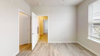 Empty room with doorway to hallway at Bridge at Windsor Park Apartments, Austin, TX 78723