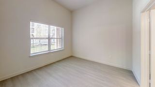 Empty bedroom with window and light flooring at Cantarra Apartments, Manor, TX 78653