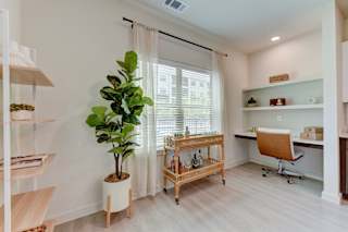 Home office with builtin desk and bar cart 1 at Cantarra Apartments, Manor