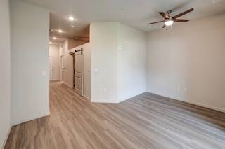 a bedroom with hardwood flooring and a ceiling fan at Avery Ranch, Austin