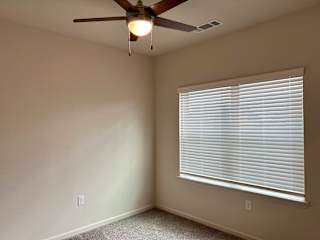 B1 Primary Bedroom at Bridge at Delco Flats Apartments, Texas