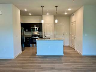 A3 Kitchen and Entry at Bridge at Delco Flats Apartments, Austin, TX