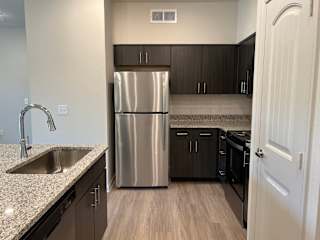 Stainless Steel Appliances at Bridge at Delco Flats Apartments, Austin, 78724