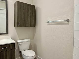 Bathroom with overhead cabinet at Bridge at Windsor Park Apartments, Austin