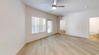 A room with a ceiling fan and a window with blinds. at Park South Apartments, Texas, 78748