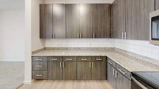 a kitchen with wood cabinets and granite countertops at Avery Ranch, Austin, 78717