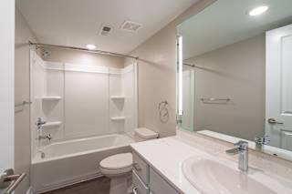 a bathroom with a bathtub and a sink at Hillside Apartments, Michigan
