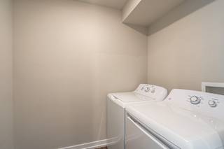 a washer and dryer in a laundry room at Hillside Apartments, Michigan, 48393