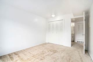A bedroom with a large closet at Apple Ridge Apartments, Walker, MI, 49534