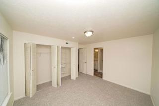 an empty living room with a closet  at Arbor Lakes Apartments, Indiana, 46516