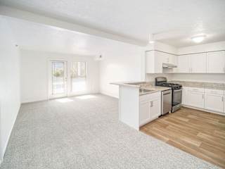 upgraded dining and living rooms leading to private patio at Black Sand Apartment Homes in Lincoln, NE