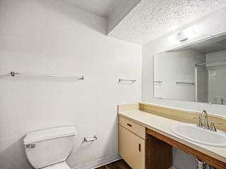 Bathroom with vanity sink and towel bars at Brentwood Park Apartments, Nebraska