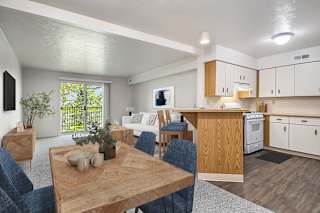 Open concept living and dining with kitchen view at Brentwood Park Apartments, La Vista