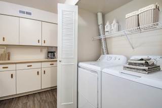 Laundry room with white washer and dryer at Brentwood Park Apartments, La Vista, 68128