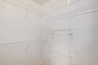 White wire shelving in walk-in closet at Black Sand Apartments Homes, Lincoln, NE 68504