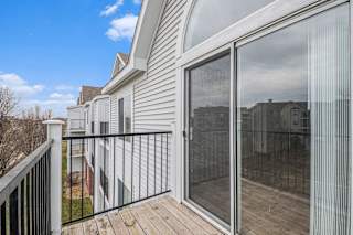 Balcony with screen door and metal railing at Black Sand Apartments Homes, Lincoln, 68504