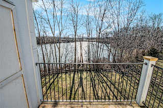 the patio view of a pond at Canal 2 Apartments in Lansing, MI