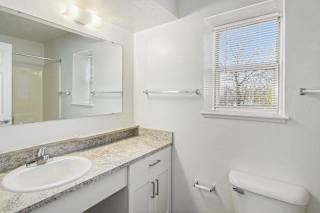 a bathroom with a window at Canal 2 Apartments in Lansing, MI