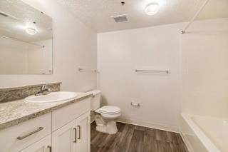 a bathroom with hard surface flooring at Canal 2 Apartments in Lansing, MI