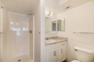 second bathroom with a walk in shower at Canal 2 Apartments in Lansing, MI