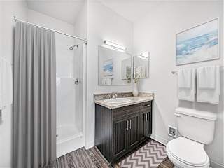 Bathroom with granite vanity and tub shower combo at Chase Creek Apartments Homes, Alabama, 35811