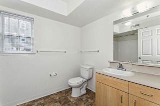 A bathroom with a window at Colonial Pointe at Fairview Apartments, Nebraska