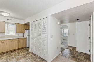 A kitchen and dining room with a window at Colonial Pointe at Fairview Apartments, Bellevue