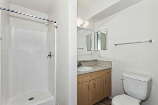 Bathroom with white shower stall and towel bar at Colonial Pointe at Fairview Apartments, Nebraska