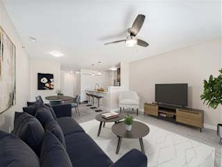 Living and dining area with modern furnishings at Copper Creek Homes Apartments, Kansas