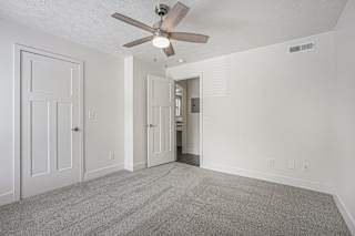 Bedroom with walk in closet at The Crossings Apartments, Michigan, 49508