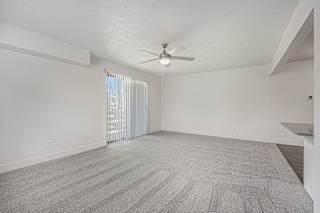 Oversized living room leading to private balcony at The Crossings Apartments, Michigan, 49508