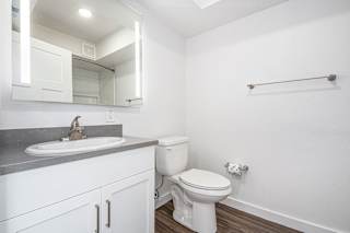main bathroom with a lighted mirror at The Crossings Apartments, Michigan, 49508