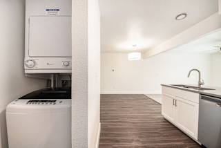 A stackable washer and dryer at The Crossings Apartments, Grand Rapids