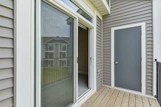 A private balcony with enclosed storage at Dodson Pointe Apartment Homes, Arkansas, 72758