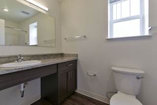 A bathroom with a window at Dodson Pointe Apartment Homes, Rogers, 72758