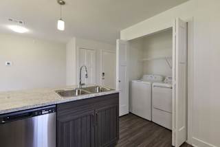 A full size washer and dryer at Dodson Pointe Apartment Homes, Rogers, Arkansas