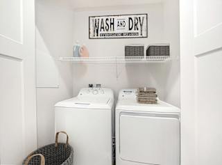 A full size washer and dryer at Dodson Pointe Apartment Homes, Rogers