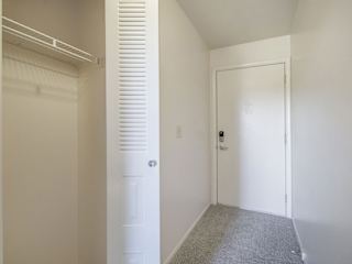 A white closet near the front door at Dupont Lakes Apartments in Fort Wayne, IN