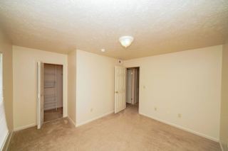 A bedroom with a walk in closet at Dupont Lakes Apartments, Indiana, 46825