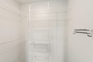Walk-in closet with organizers at Eagle Ridge Apartment Homes, Traverse City, MI 49685