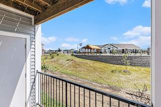 A patio/balcony with a view at Eagle Ridge Apartment Homes, Traverse City, MI 49685