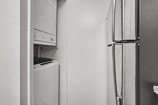 A washer and dryer in a kitchen at Emerald Park Apartments, Kalamazoo, Michigan