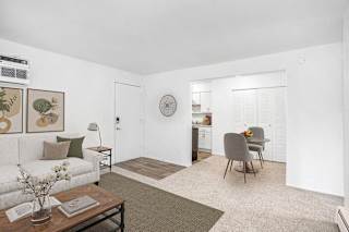 dining room with a kitchen in the background at Fairlane Apartments in Springfield, 49037