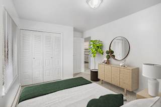 A large bedroom with a closet at Glen Oaks Apartments, Michigan, 49442