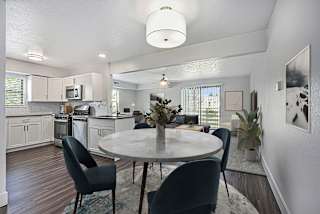 a modern kitchen with a window and dining room at Green Ridge Apartments, Grand Rapids, 49544