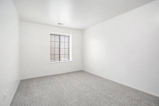 a second bedroom with a window at Hampton Lakes Apartments, Michigan, 49534