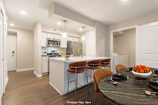a kitchen and dining area in a 555 waverly unit at Hillside Apartments, Michigan, 48393