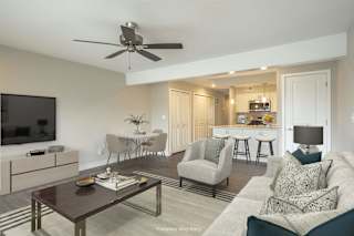 a living room and kitchen in a 555 waverly unit at Hillside Apartments, Wixom, MI, 48393